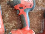 three electric tools that are sitting on a table