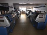 many machines that are lined up in a room