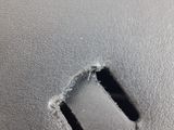 a close up of a piece of metal with a hole in it