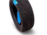 a close up of a tire on a white surface with a blue strip