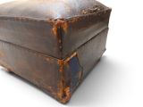 an old suitcase that is sitting on a white surface