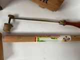 a baseball bat and a hammer sitting on a table