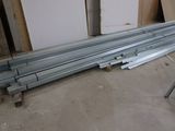 several pieces of metal are stacked on top of each other in a room