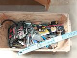 a wooden box filled with tools and a pair of scissors