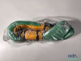 a pair of boxing gloves wrapped in plastic on a table