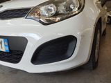 a white car that is parked in a garage