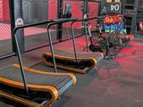 a gym with two treads in the middle of the room