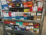 a metal cart with many boxes of cigarettes on top of it