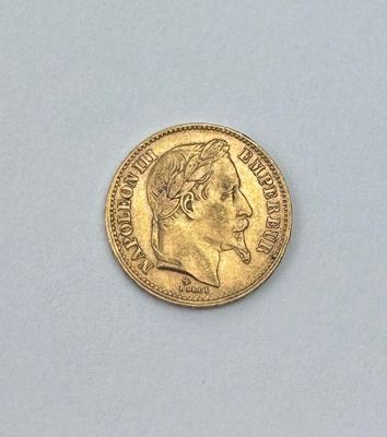 gros plan d'une pièce d'or sur laquelle figure le visage d'un homme