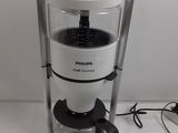 a coffee maker that is sitting on a table