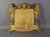 a small wooden frame with two angels on it