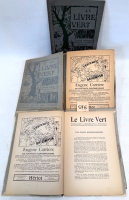 several old books sitting on top of each other on a table