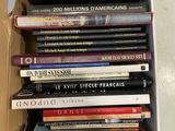 a lot of books in a box on the floor