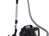 a close up of a vacuum and a canister on a white background
