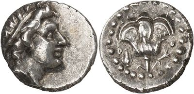 a silver coin with an image of a woman on it