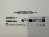 the back of a white laptop with a black and white sticker on it