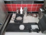 a picture of a kitchen with a stove and a sink