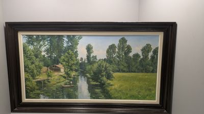 une photo d'un tableau accroché au mur