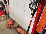 two jacks that are on the ground in the garage