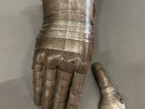 a metal glove that has been placed on a table