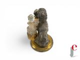 figurine of a dog with a perfume bottle on a stand