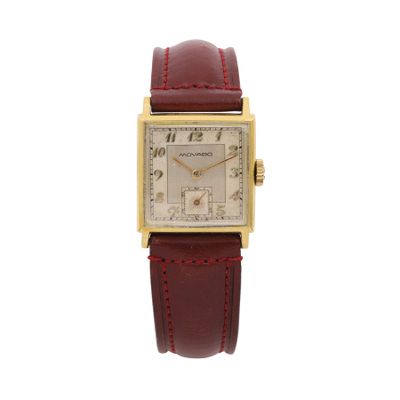 a close up of a watch on a white background with a red strap
