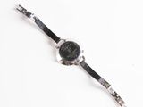 an image of a wrist watch on a white surface with a white background
