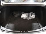 a bag in the trunk of a car with luggage in it