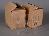 two empty wine glasses in front of a cardboard box