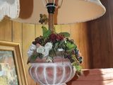 a lamp that is sitting on a table in a room