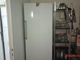 an image of a kitchen with a refrigerator in it