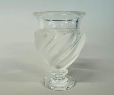 a clear glass vase with a spiral design on it