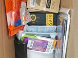 a cardboard box filled with assorted items in it