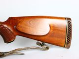 an old wooden rifle with a metal handle and a wooden handle
