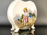 a small white plate with a picture of a girl on it