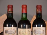 three bottles of wine sitting next to each other on a table