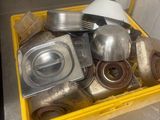 a yellow container filled with pots and pans on a table