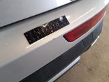 the rear end of a silver car with a sticker that says vauto