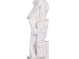a white marble sculpture of a man holding a bag