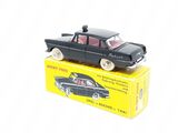 a black toy car sitting on top of a yellow box