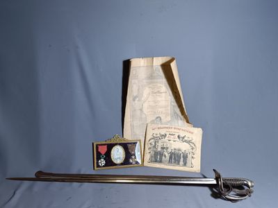 a picture of a sword and some other items on a table