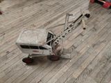 a toy truck that is sitting on a wooden floor