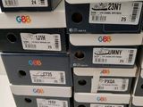 several boxes of different sizes and colors are stacked on top of each other