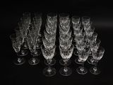 a lot of empty wine glasses on a black table