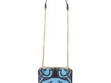 a black and blue handbag with a design on the front