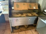 boxes are stacked on top of a stove in a kitchen