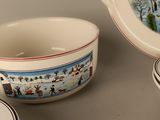 many plates and bowls that are on the table