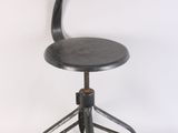 a black stool with a wooden seat on a white background