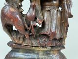a bronze statue of a man and a woman on a horse