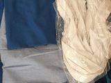 a box of clothing that is sitting on the floor